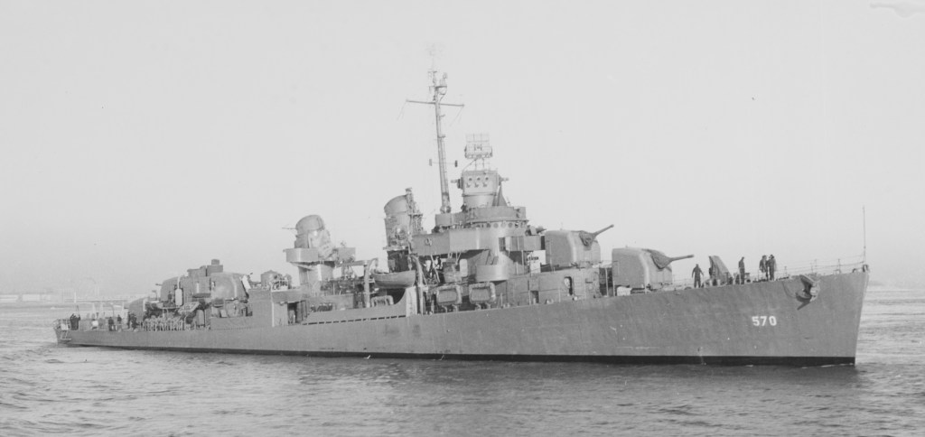Destroyer Charles Ausburne, DD 570, has multiple radar sets visible, one for fire control atop the director and two search radars on the mast.